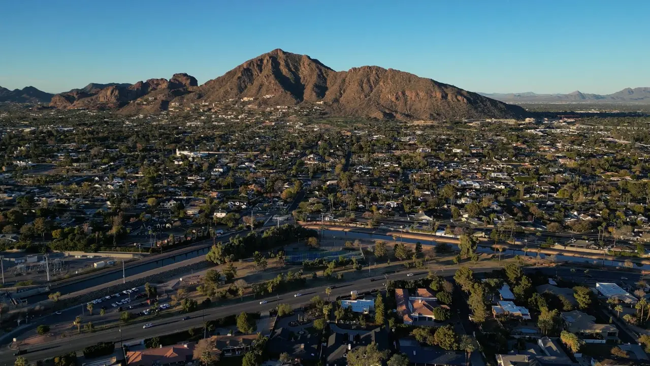 Aerial view of Scottsdale neighborhoods with Camelback Mountain on the horizon