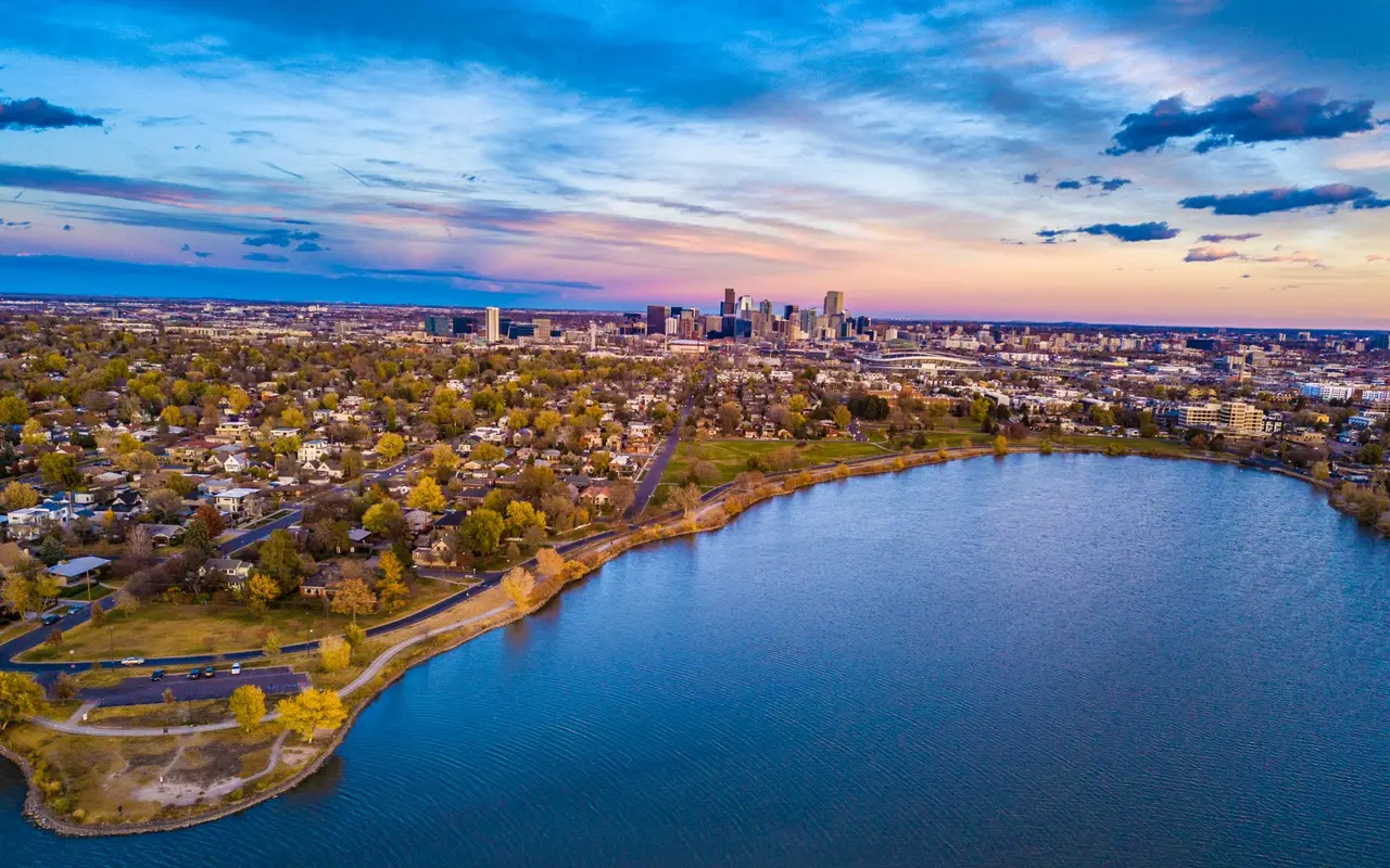 Aerial view of Sloan’s Lake with the Denver skyline at sunset